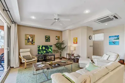 a living room with a couch and a table at Casa feng shui in Tamarindo