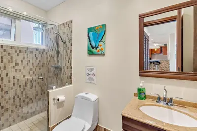 a bathroom with a toilet and a sink at Casa feng shui in Tamarindo