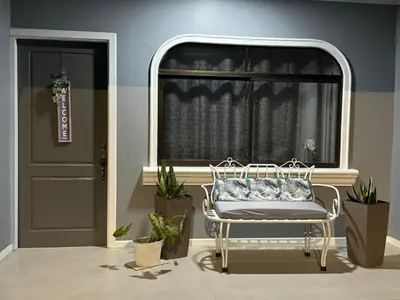 a white chair in a room with a window at B&B Pacuare River Gateway Tica House in Linda Vista