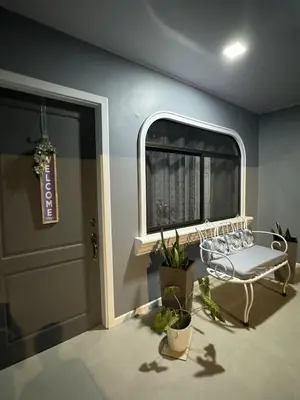 a room with a window and a bench next to a door at B&B Pacuare River Gateway Tica House in Linda Vista