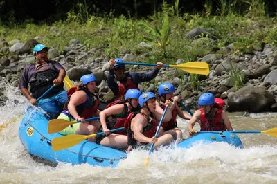 a group of people are rafting on a river at B&B Pacuare River Gateway Tica House in Linda Vista