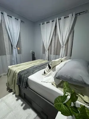 a bedroom with a large bed with white curtains at B&B Pacuare River Gateway Tica House in Linda Vista