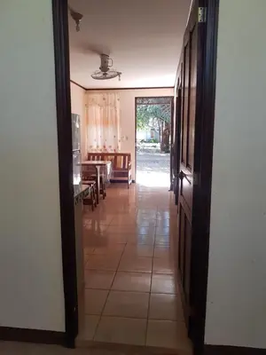 an open door to a hallway with a dining room at Cabinas en Playas del Coco in Sardinal