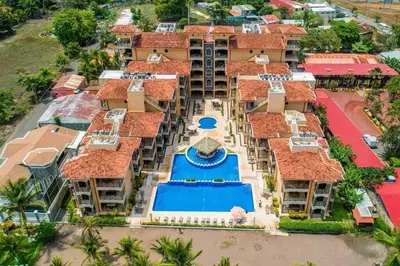 an aerial view of a resort with a swimming pool at Jaco Beachfront Oasis Newly renovated dream condo in Jacó