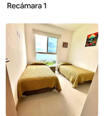 a bedroom with two beds and a window at Grettabril JACO BEACH APARTMENT in Jacó