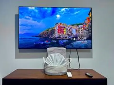 a flat screen tv hanging on a wall at Casa Plata - 10 bed, 5 bdrm - One Block from Clubs in Jacó