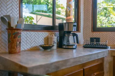 a counter top with a coffee maker on it at Jungle Glory Home Arriba in Manuel Antonio
