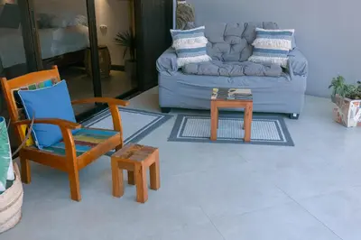 a living room with chairs and a couch at Jungle Glory Home Arriba in Manuel Antonio