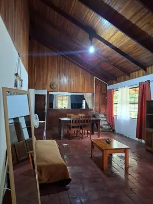 a living room with a couch and a table at Coco Beach House in Coco
