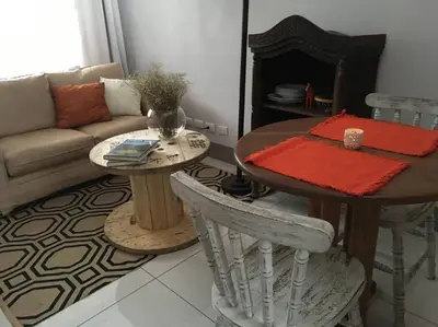 a living room with a table and a couch at Bello espacio en zona rodeada de naturaleza Apt 2 in Curridabat