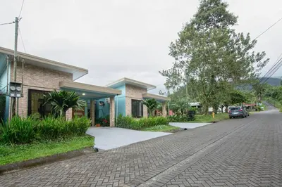 a cobblestone street in a town with houses at Casa Serenity Arenal,Fully Equip in Fortuna