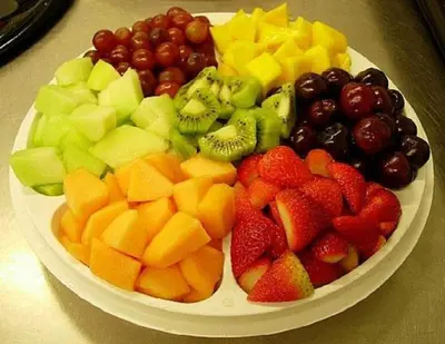 a platter of fruit on a plate on a table at Casa Echavarria in San José