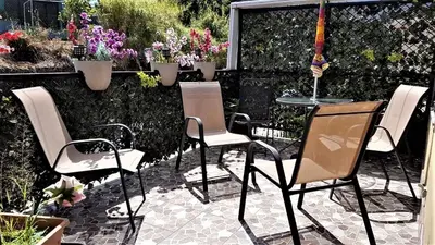 a group of chairs and a table in a garden at Casa Echavarria in San José