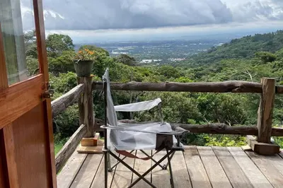 a chair sitting on the deck of a house at \u58ee\u89c2\u666f\u8272\u7684\u5b81\u9759\u6728\u5c4b in Santa Ana