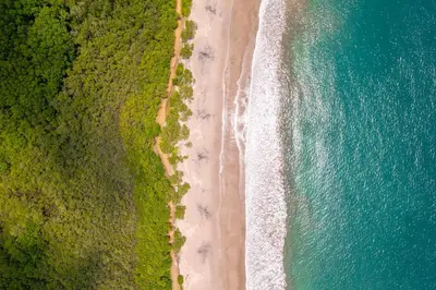 an overhead view of a beach and the ocean at Casa Tranquilo 26B - Beautiful Home With A Private Pool in Playa Flamingo