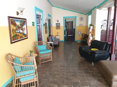a living room with a couch and chairs at Hotel Liberia in Liberia