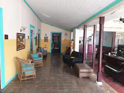 a living room with couches and chairs at Hotel Liberia in Liberia