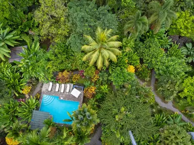 an overhead view of a garden with a swimming pool at Bukala Village Lodge in San Ramón