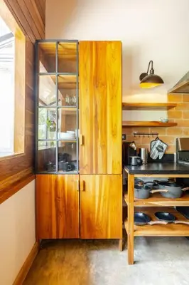 a kitchen with wooden cabinets and a counter top at Casa PlayaAzul, walk to the beach, 3 rooms in Santa Teresa Beach
