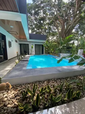 a swimming pool in front of a house at Fortuna Jungle & River Retreat - Private pool, River and Wifi in the forest - Secluded, peaceful, truly UNIQUE! A GEM! Book Now! in Guayabal