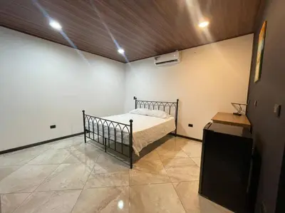 a bedroom with a bed in a room at Fortuna Jungle & River Retreat - Private pool, River and Wifi in the forest - Secluded, peaceful, truly UNIQUE! A GEM! Book Now! in Guayabal