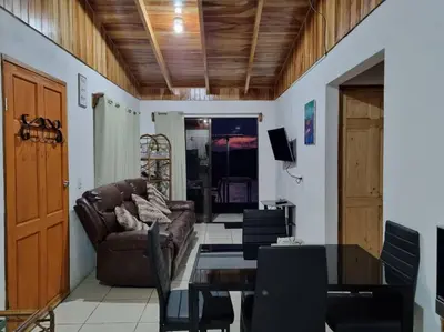 a living room with a couch and a table at Magic Place Monteverde in Monteverde Costa Rica