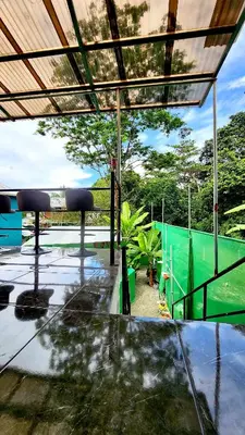 a view of a pool from the inside of a house at H et L in Tortuguero