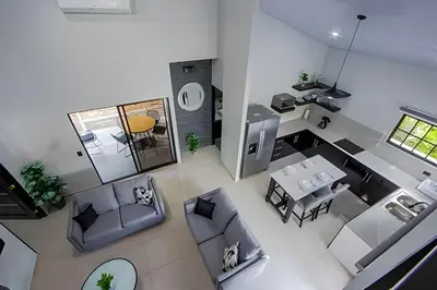 an overhead view of a living room with a table and chairs at Villa Escondida La Fortuna in Fortuna