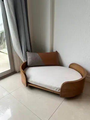 a wooden bed sitting in a room next to a window at Villa Verde 2 Casa 14 in Tamarindo