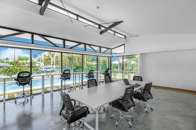 a conference room with a table and chairs at Upstay - New Condo in Jaco - 5 mins from Beach in Jacó