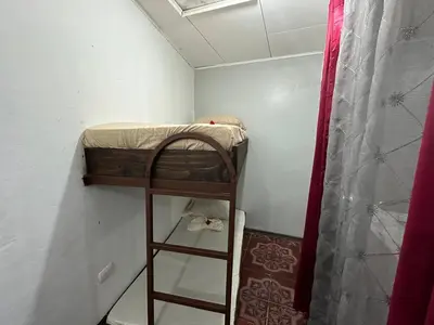 a small room with a bunk bed in it at Hotel Villa Marsella in Marsella