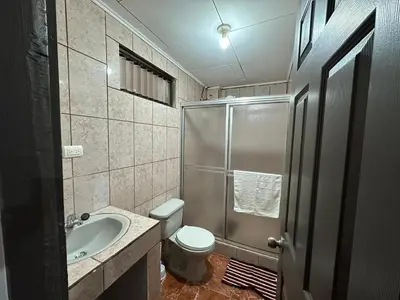 a bathroom with a shower and a toilet and a sink at Hotel Villa Marsella in Marsella