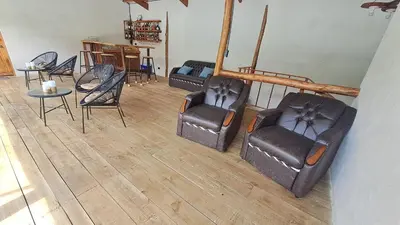 a group of chairs and tables in a room at S Natura Birding and Photography in Villa Mills