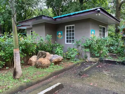 a small house with rocks in front of it at Manzu in Santa Cruz
