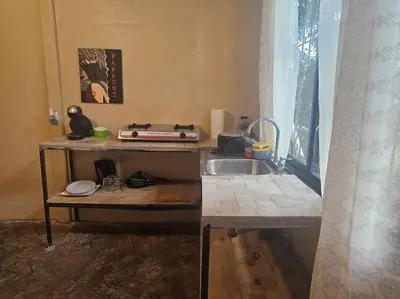 a kitchen with a sink and a counter top at Departamento Económico, Familiar in San Isidro