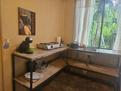 a kitchen with a counter and a sink and a window at Departamento Económico, Familiar in San Isidro