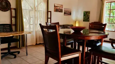 a dining room with a table and chairs at 2bd 2bth Vacation villa in Tamarindo, Costa Rica in Tamarindo