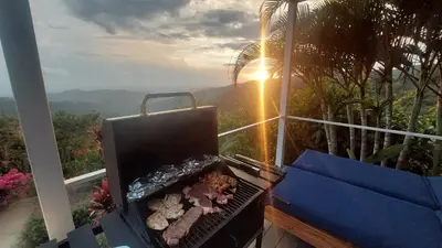 a grill with stuffed animals on it on a balcony at Palco Pacifico at The Retreat in Atenas