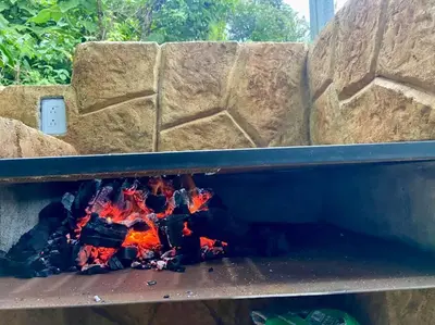 a fire pit with a fire in it at Chalet Luna y Miel in Dulce Nombre