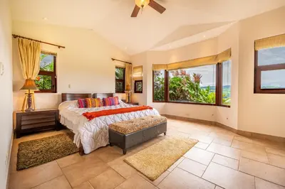 a bedroom with a bed and a large window at Casa Shamrock Duplex 1 in Unión