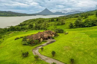 an aerial view of a house on a hill next to a river at Casa Shamrock Duplex 1 in Unión