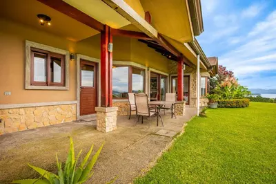 a house with a patio with a table and chairs at Casa Shamrock Duplex 1 in Unión