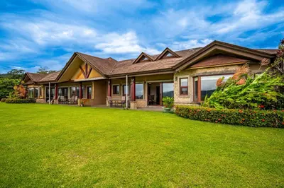 a house with a green lawn in front of it at Casa Shamrock Duplex 1 in Unión