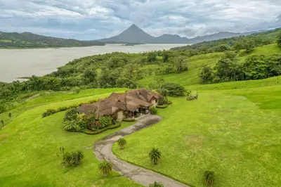 an aerial view of a house on a grassy hill at Casa Shamrock Duplex 2 in Unión
