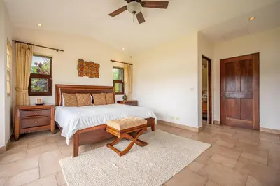a bedroom with a bed and a ceiling fan at Casa Shamrock Duplex 2 in Unión