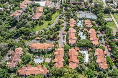 an overhead view of a residential neighborhood with houses at Pacifico TH-104 in Coco