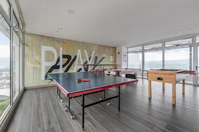 a room with two ping pong tables and a mural at Skyline iFreses, 22nd floor! AC, TV and Pool in Guayabos