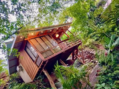 a tree house in the middle of the forest at Cabaña Luna Arenal in Fortuna