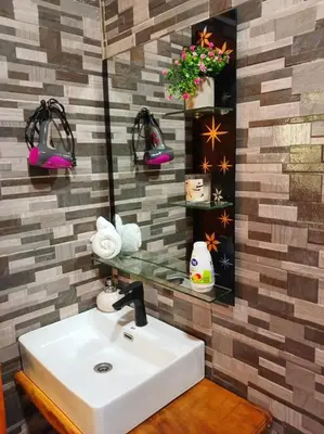 a bathroom with a sink and a mirror at Cabaña Luna Arenal in Fortuna