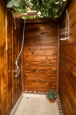 a room with a wooden door with a plant at Rousse Cabin in Rivas